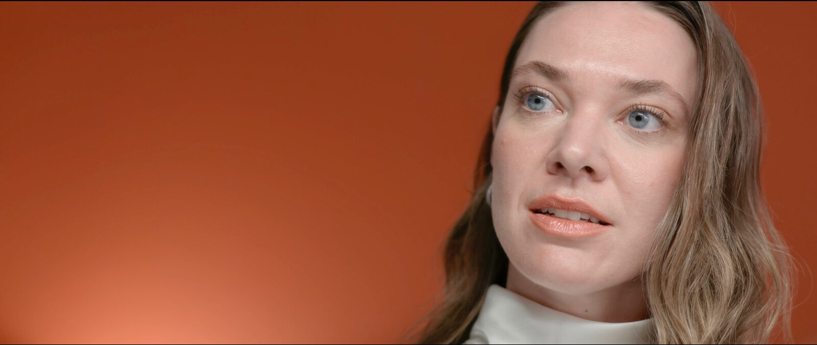 Still — Nadia, orange backdrop